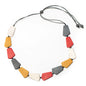 Red resin pentagon necklace by Suzie Blue Canada featuring a geometric pendant on a delicate chain.