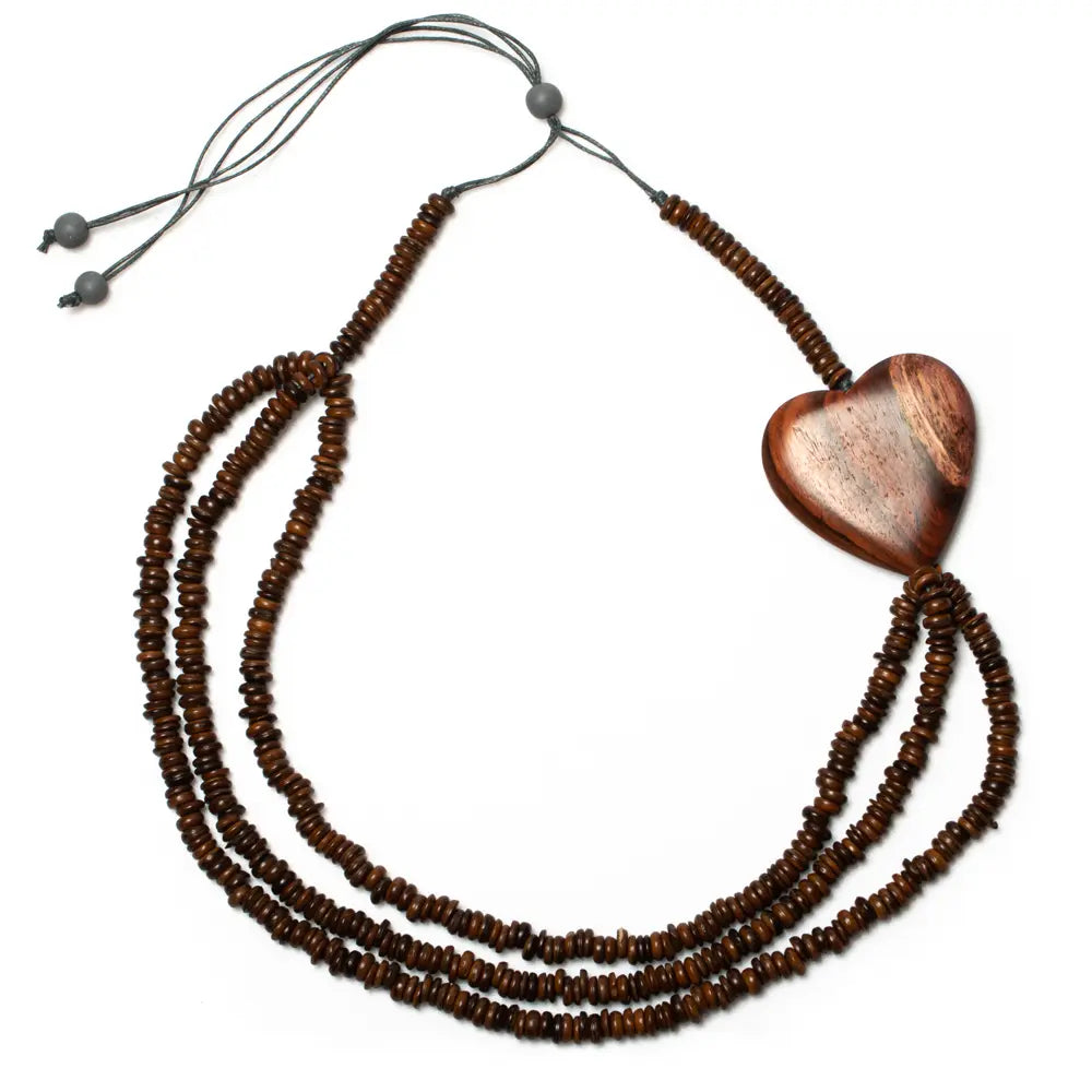 Triple strand coconut bead necklace with wooden heart accent, featuring natural wooden and coconut bead details.