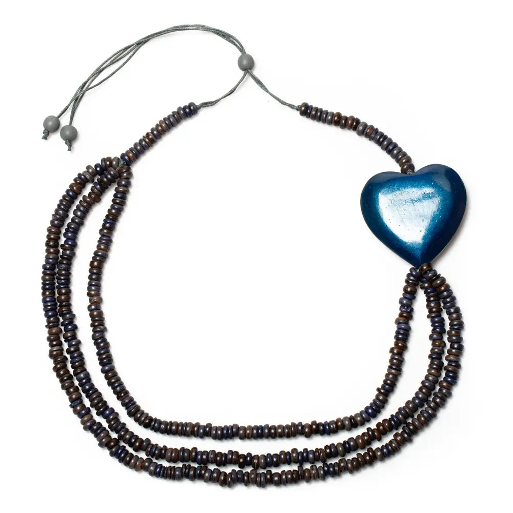 Triple strand coconut bead necklace with wooden heart accent from Suzie Blue Canada, featuring natural wooden and coconut beads.