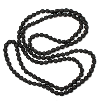Extra long fabric ball necklace by Suzie Blue Canada featuring colorful fabric-covered beads on a long chain.