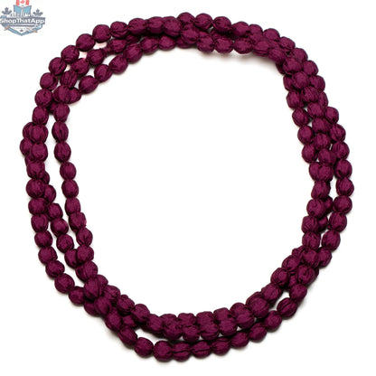 Suzie Blue Canada extra long fabric ball necklace with large colorful fabric-covered beads on a long chain.