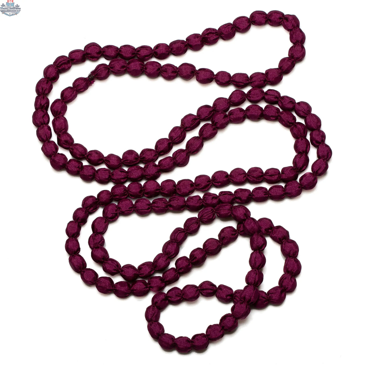 Suzie Blue Canada extra long fabric ball necklace with colorful fabric balls on a chain, stylish jewelry accessory.