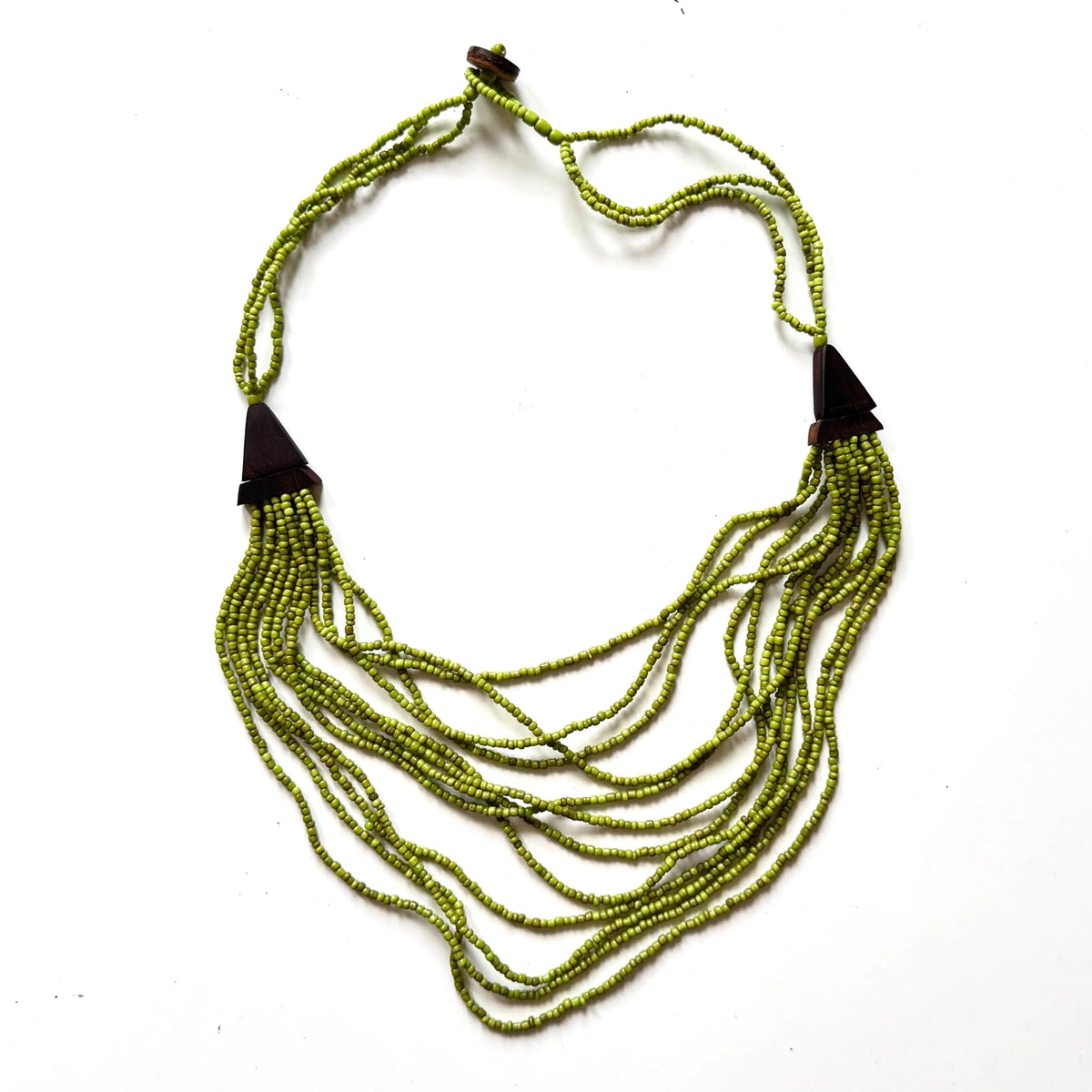 Multi-strand wood necklace with unique detailing from Suzie Blue Canada, featuring natural wooden beads and intricate design.
