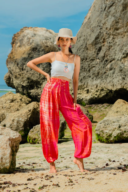 Pink tie dye Bali pants by Suzie Blue Canada featuring a stylish, relaxed fit and vibrant pattern.