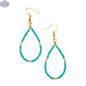 Tear drop seed bead earrings with gold accents, featuring a chic design by Suzie Blue Canada.