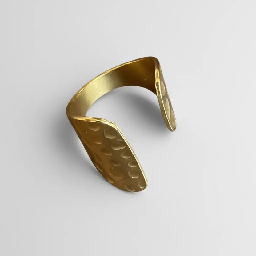 Gold stainless steel Beaten Cuff Ring by Suzie Blue Canada, featuring a textured, modern design with a cuff style.