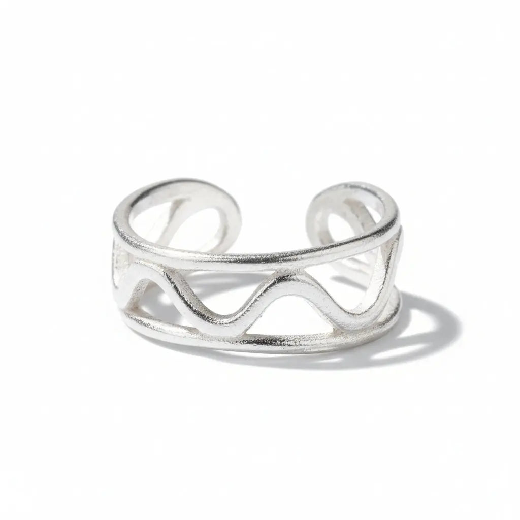Silver wavy ring with elegant design by Suzie Blue Canada, featuring a sleek silver plate finish and stylish curves.