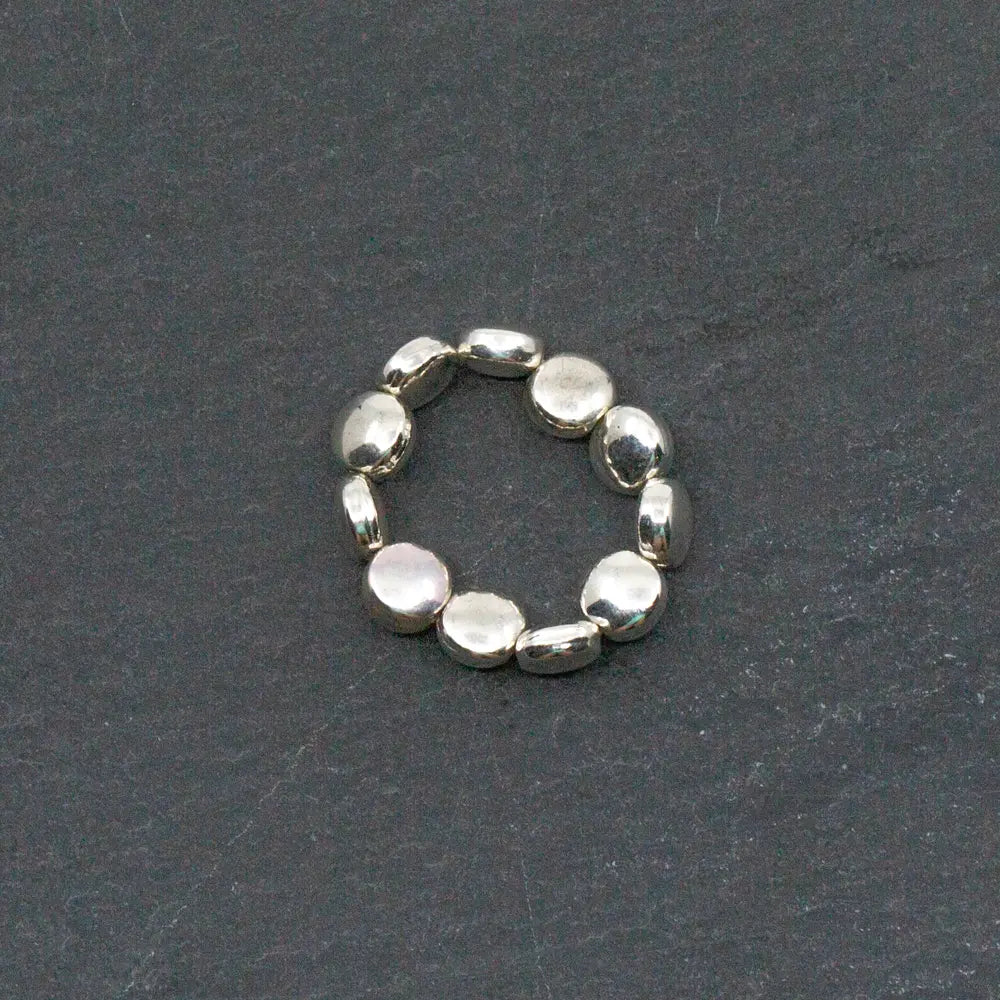 Silver disc ring with elasticated band by Suzie Blue Canada, featuring a polished silver plate finish for a stylish look.