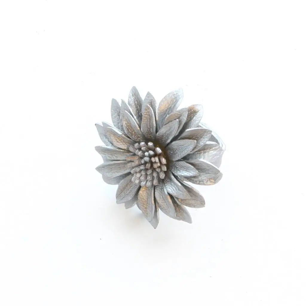 Leather flower ring by Suzie Blue Canada featuring a detailed floral design on a sleek ring band.