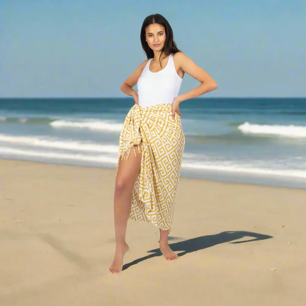 Yellow geometric print sarong by Suzie Blue Canada, perfect for trendy summer style, shown with vibrant pattern and lightweight fabric.