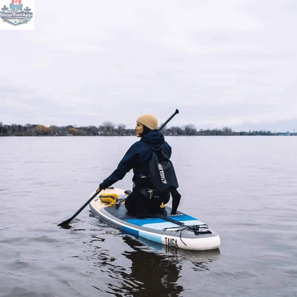 Taiga Board 20L dry bag with adjustable carbon paddle, waterproof gear storage for water sports and outdoor adventures.