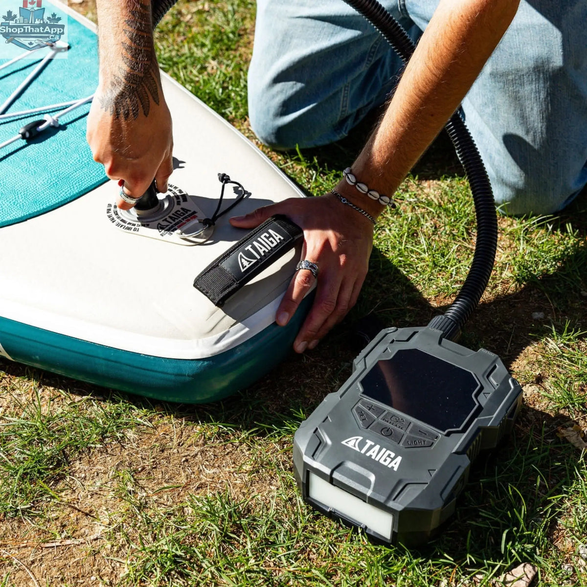 Taiga Board premium electric pump for inflatable paddle boards, battery-operated, 22 PSI, portable accessories for quick inflation.