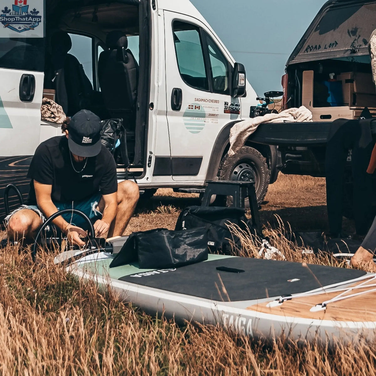 Taiga Board premium electric pump for inflatable paddle boards, showing battery operation and digital pressure display.