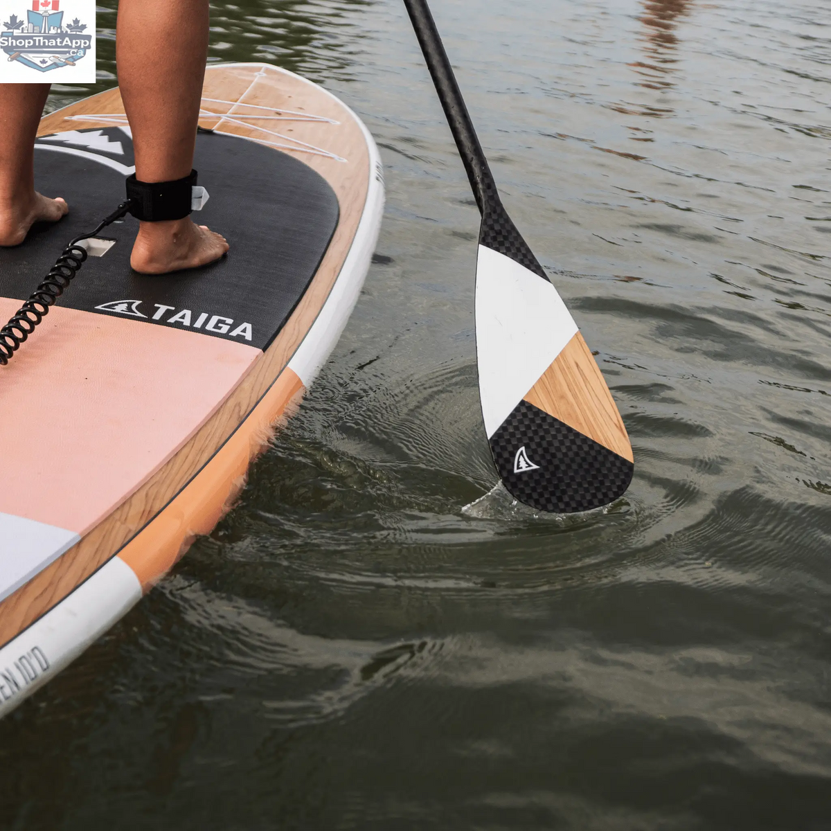 Taiga Board Diamond Paddle, asymmetric one-piece design with wood and 12k carbon, showcasing its sleek craftsmanship and build.