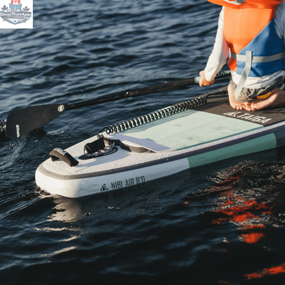 NIBI 8'0" inflatable paddle board for kids by Taiga Board, shown with complete kid paddle board kit on water.