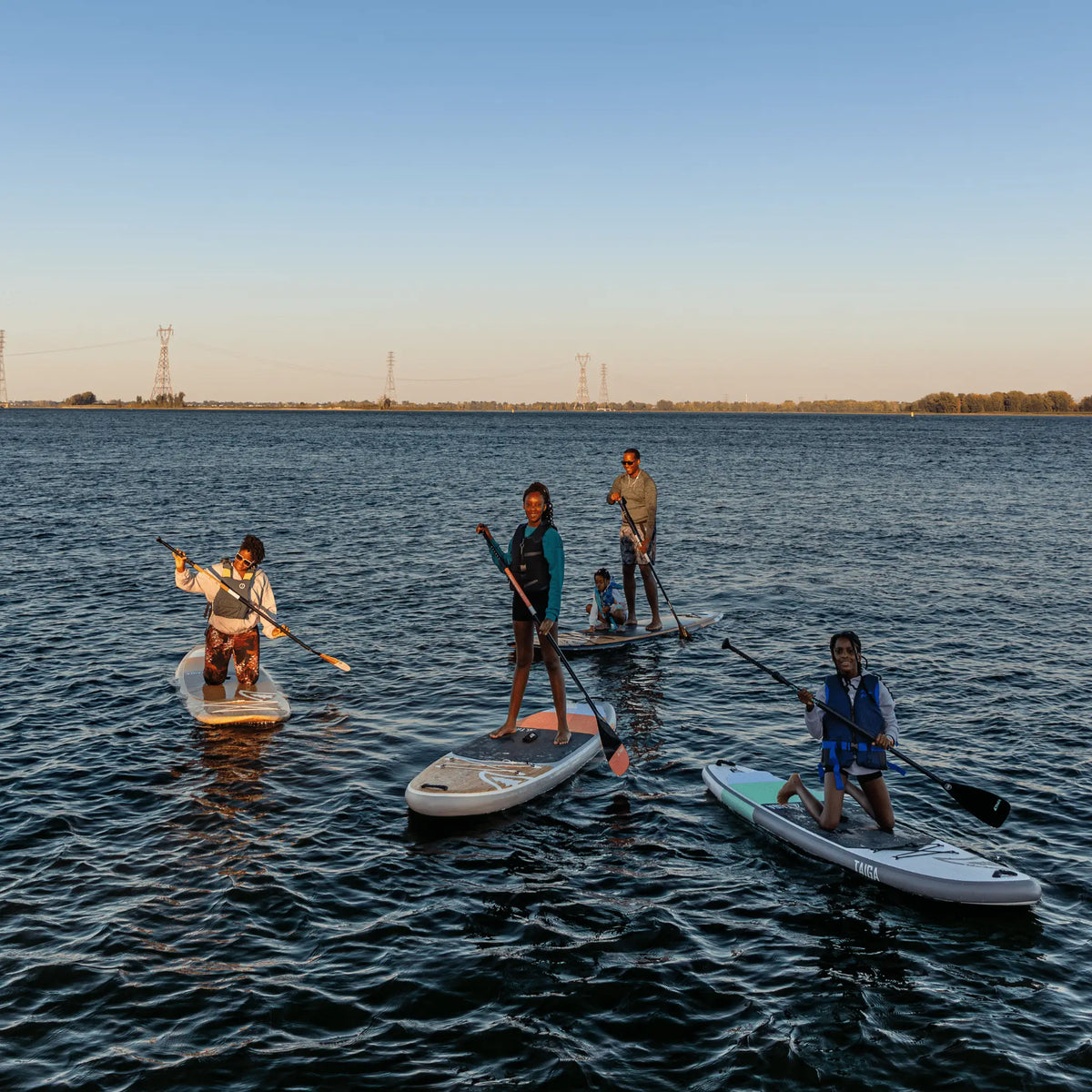 NIBI 8'0'' inflatable paddle board for kids by Taiga Board with kid-friendly accessories in a complete SUP kit.