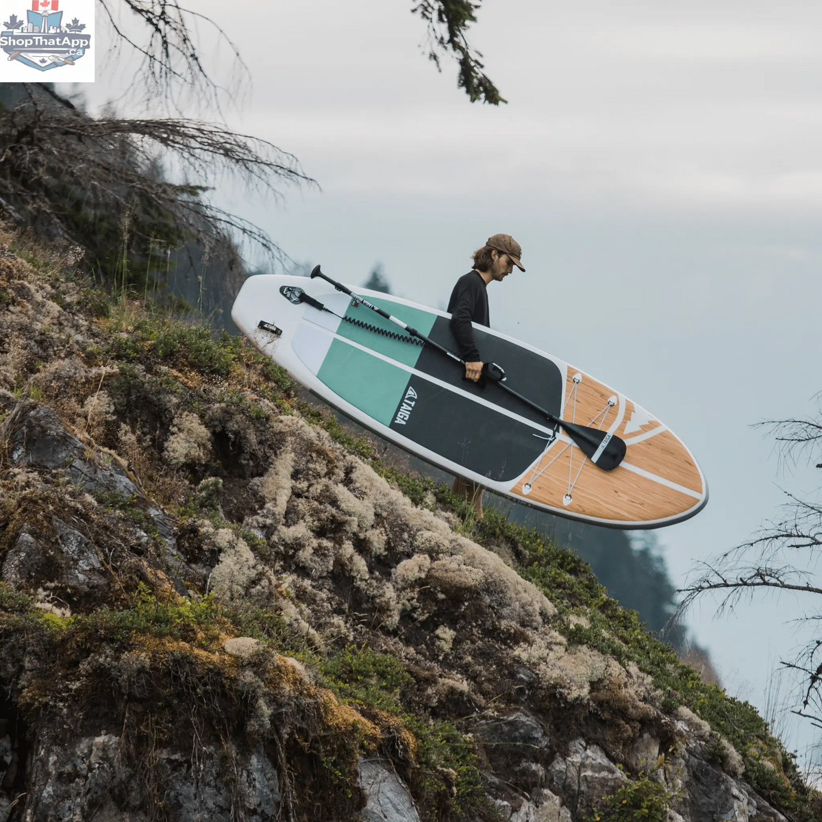 Taiga Board Nano Zip Air 9'8" compact inflatable paddle board on water, showcasing its sleek design and portable size.