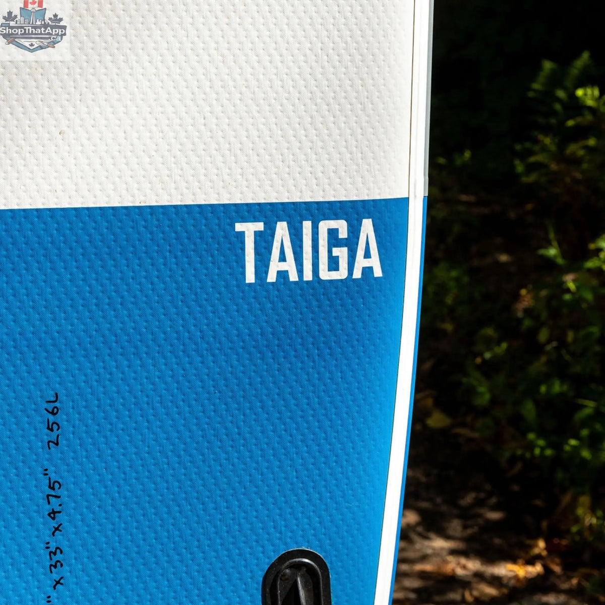 Taiga Board UKEE 10'8'' inflatable paddle board in the value kit, shown deflated with pump and accessories ready for inflating.