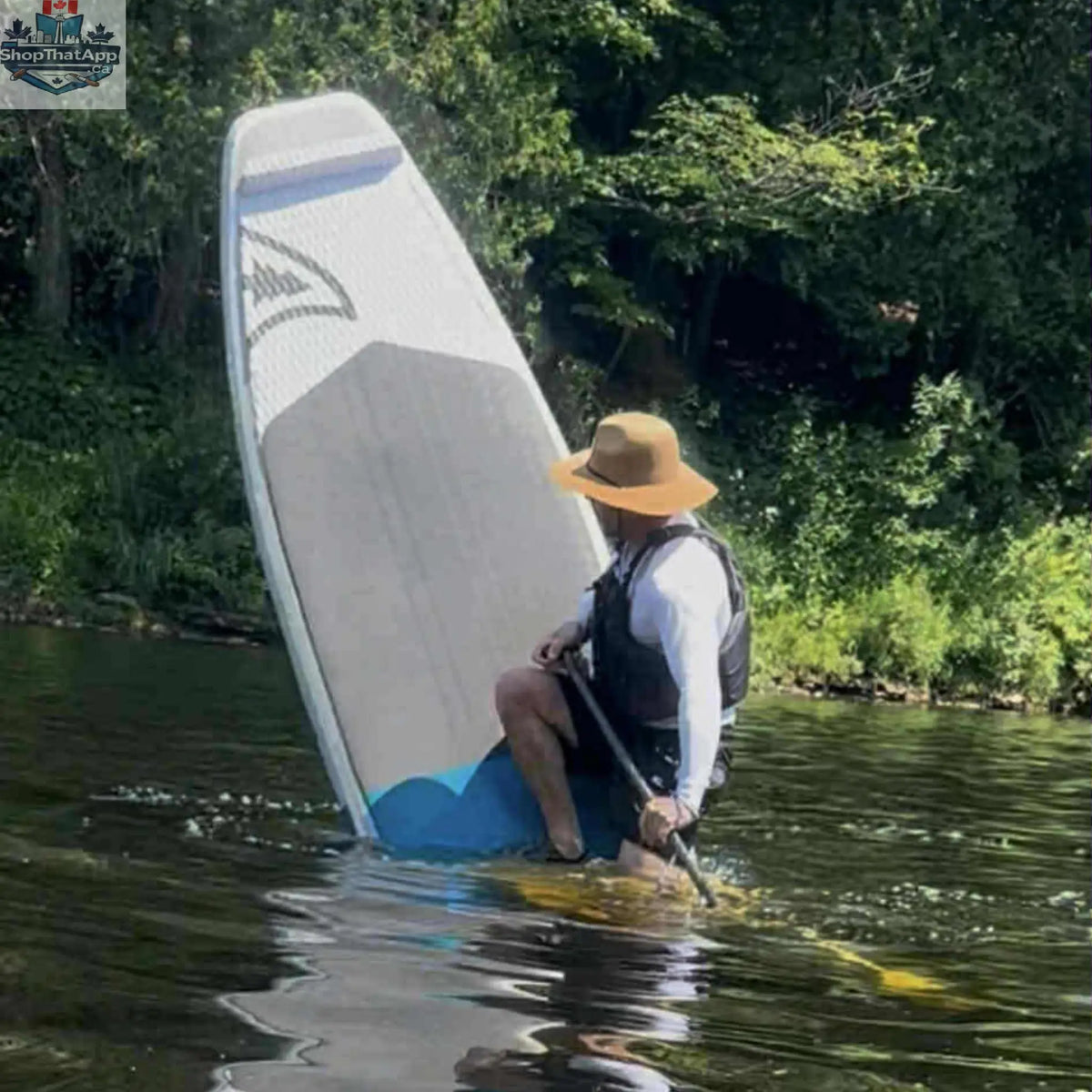 Taiga Board Freestyle 9'10" inflatable SUP paddle board on water, showcasing its sleek design and versatile shape.