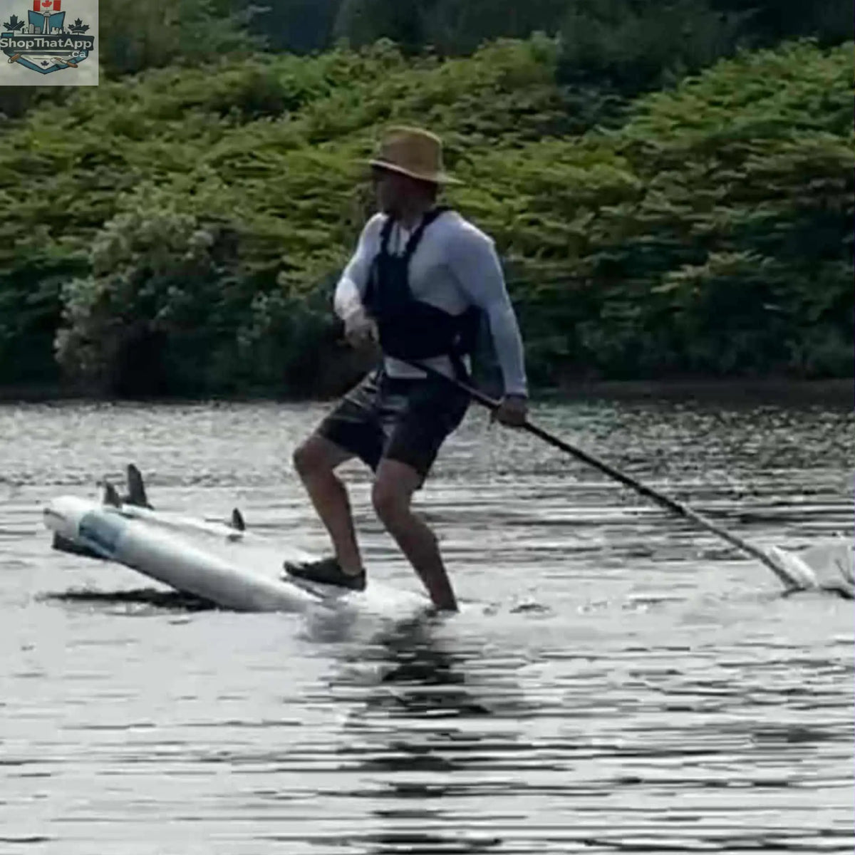 Taiga Board Freestyle 9'10" inflatable SUP paddle board on water, showcasing its sleek design and sturdy construction.