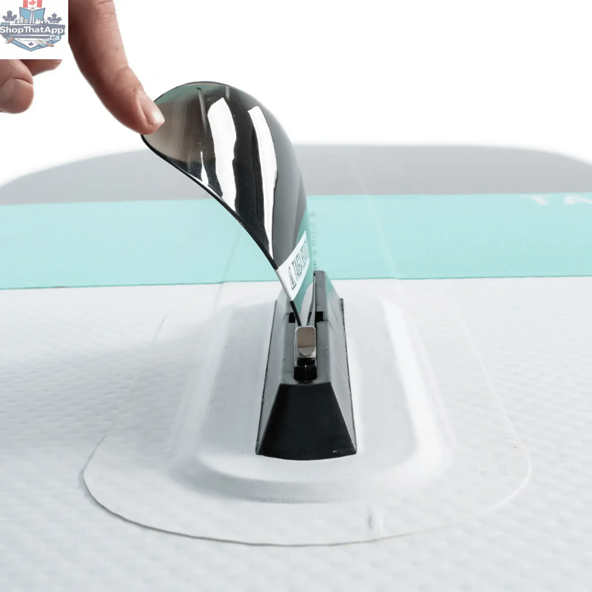 Taiga Board Freestyle 9'10" inflatable SUP paddle board on water, showcasing its sleek design and durable construction.