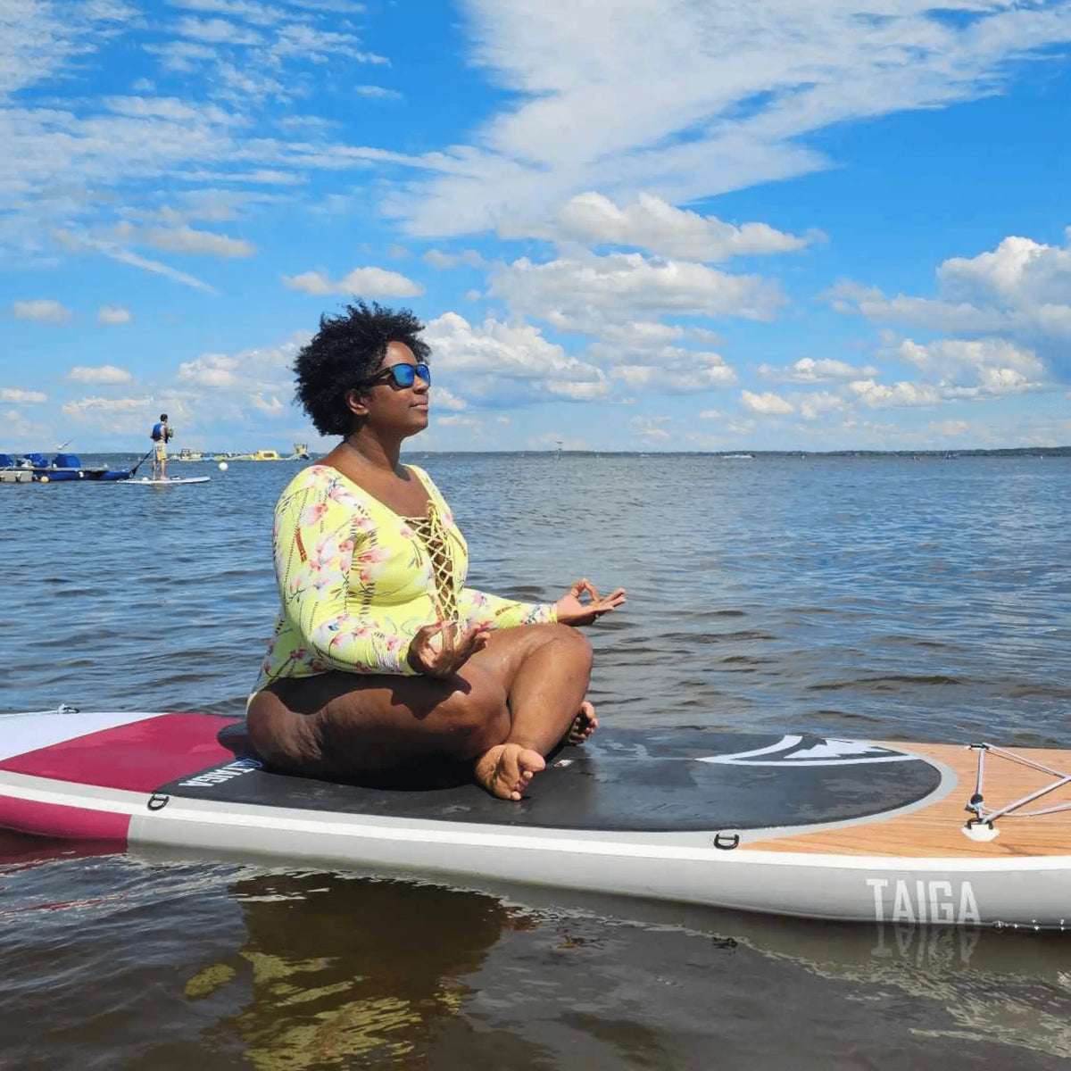 Taiga Board AWEN 10'0'' inflatable SUP paddle board on water, showcasing its sleek design and sturdy construction for water adventures.