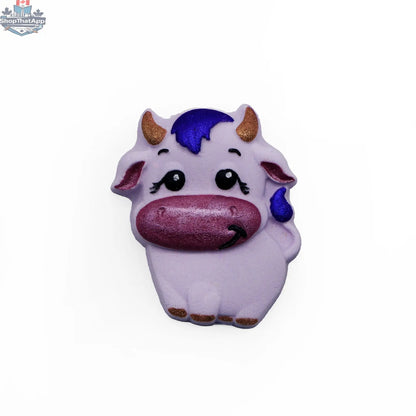 Charming cow wall art with lashes, decorative cow decor for home, from The Bomb Bar Canada, suitable for unique wall accents.