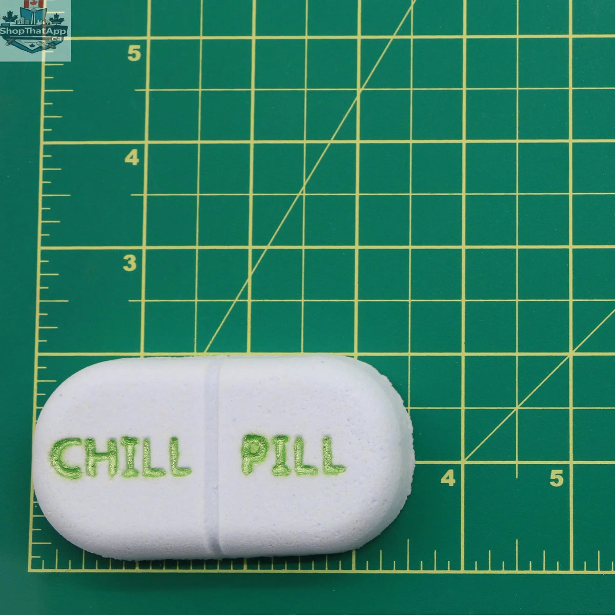Mini Chill Pill bath and body product by The Bomb Bar Canada, showing a small, colorful chill pill-shaped bath bomb.