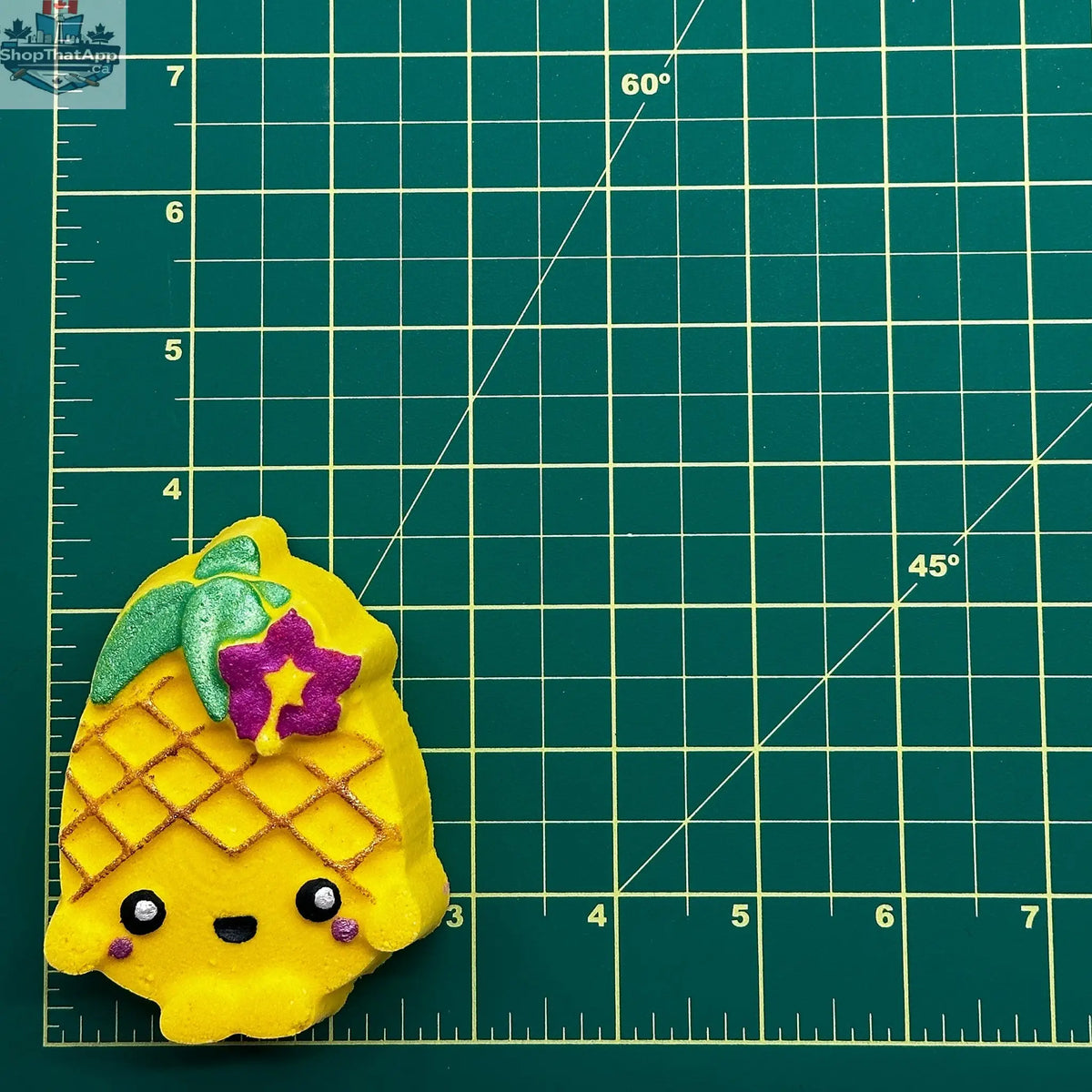 Whimsical pineapple with face decor for bath and body, from The Bomb Bar Canada, ideal for fun home accents.