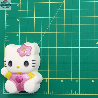 Hello Kitty plush toy from The Bomb Bar Canada, featuring a soft, cuddly cat plush with a cute Hello Kitty design.