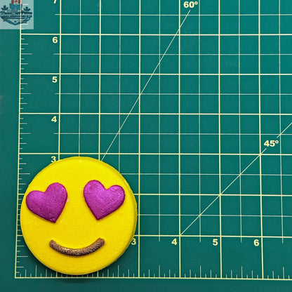 Mini Heart Eyes Emoji bath bomb by The Bomb Bar Canada, featuring a colorful heart-eyed emoji design for relaxing bath time.