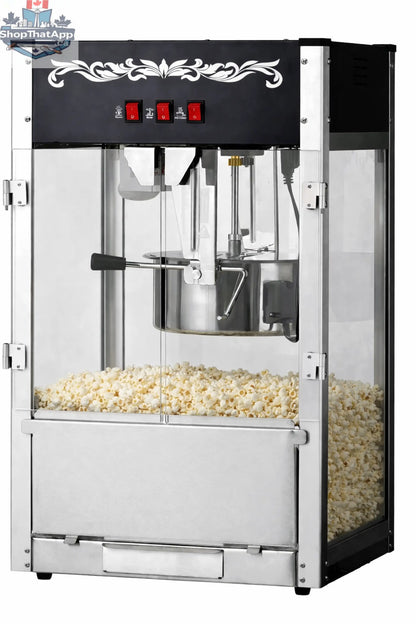 16oz black commercial popcorn machine by The Canada Popcorn Company with stainless steel kettle and built-in warming deck.