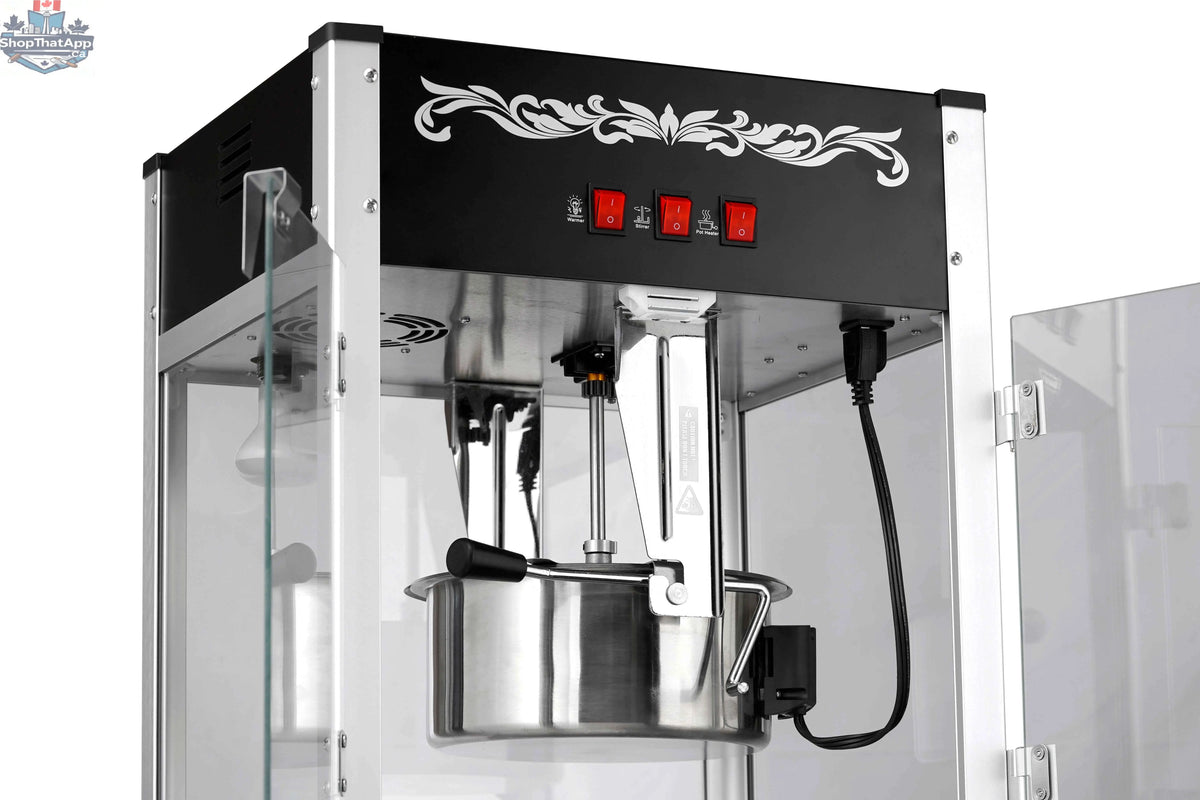 16oz black popcorn machine for commercial use by The Canada Popcorn Company, showing the machine with popcorn inside.