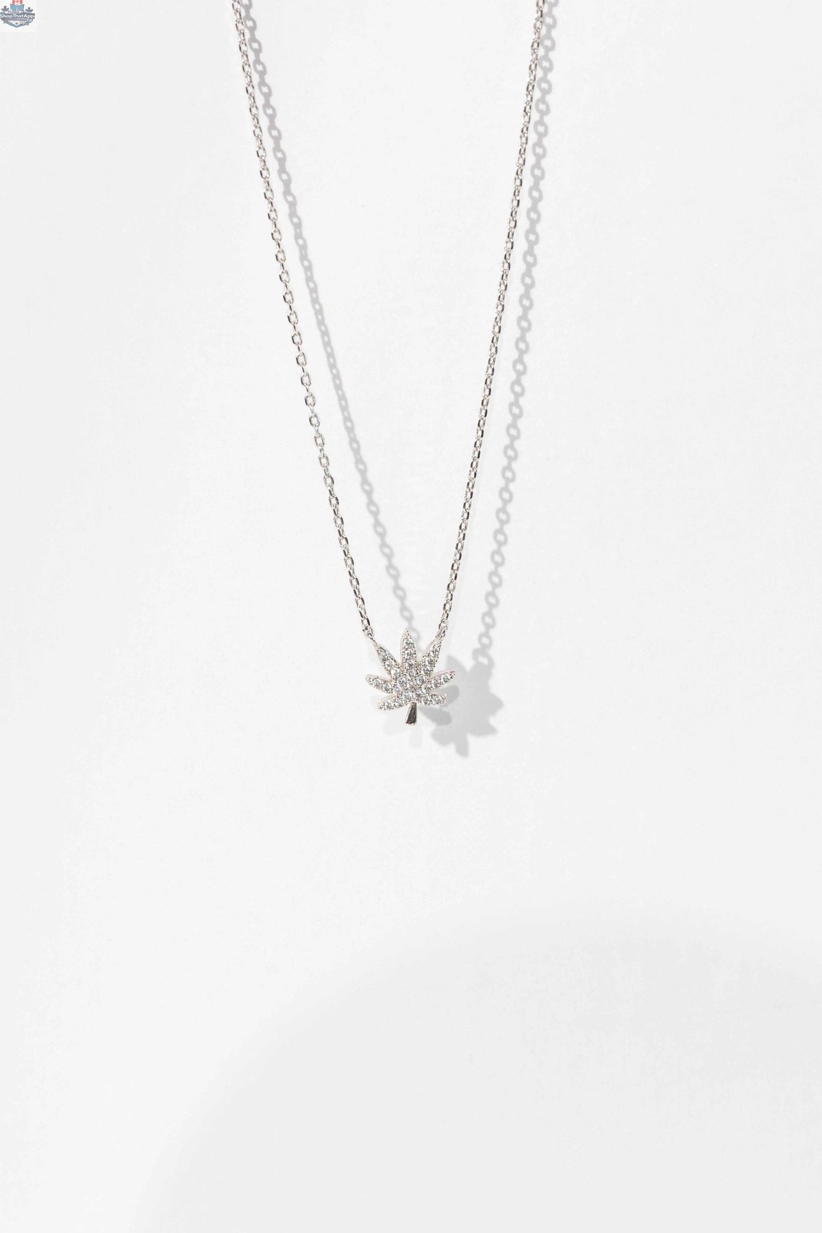 Silver cannabis leaf necklace featuring intricate leaf design, stylish jewelry piece by The Kush Girls.