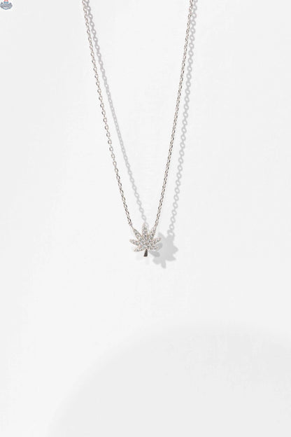 Silver cannabis leaf necklace featuring intricate leaf design, stylish jewelry piece by The Kush Girls.