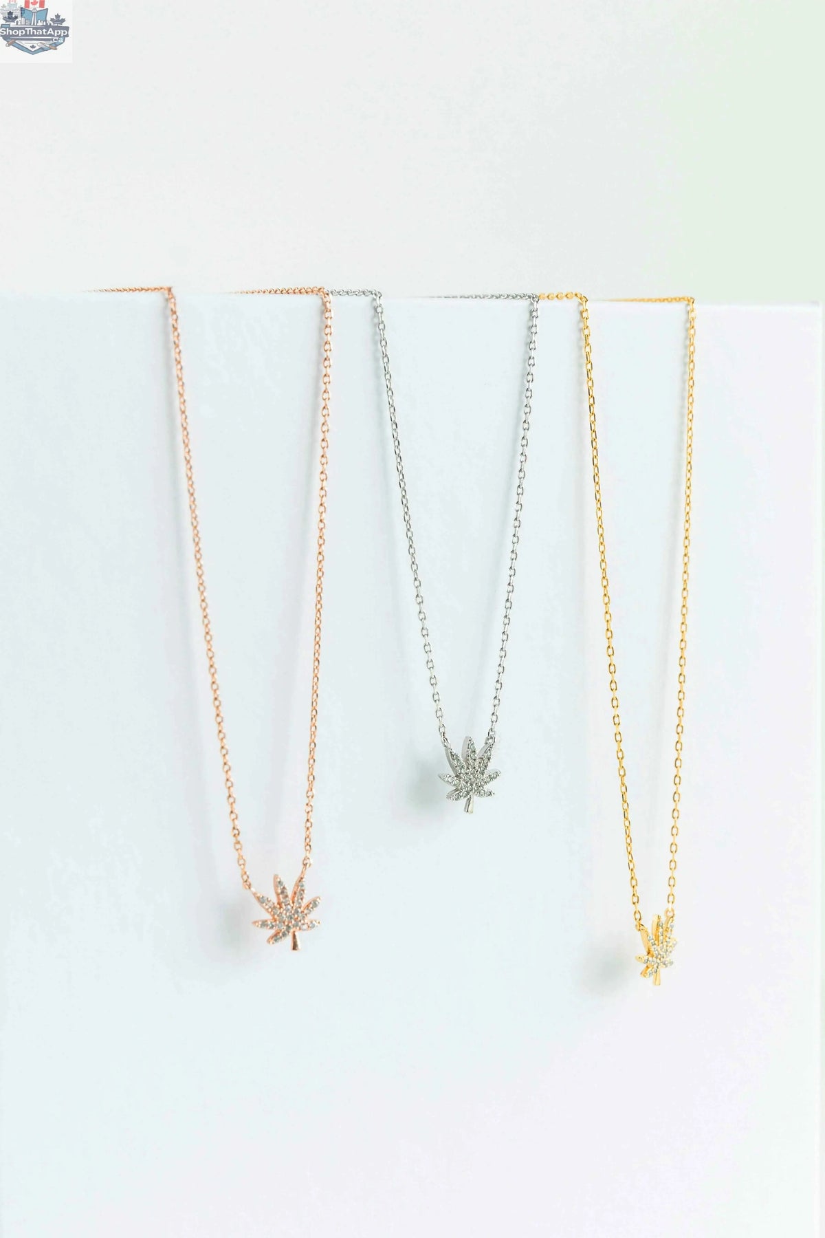Silver cannabis leaf necklace from The Kush Girls featuring a detailed cannabis leaf pendant on a delicate chain.