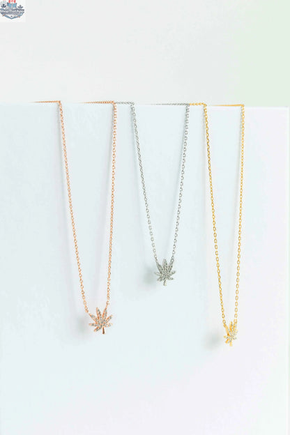Silver cannabis leaf necklace from The Kush Girls featuring a detailed cannabis leaf pendant on a delicate chain.