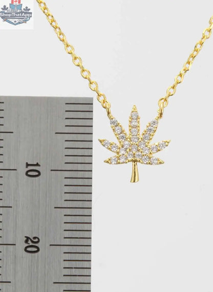 Silver cannabis leaf necklace by The Kush Girls featuring a detailed cannabis leaf pendant on a silver chain.