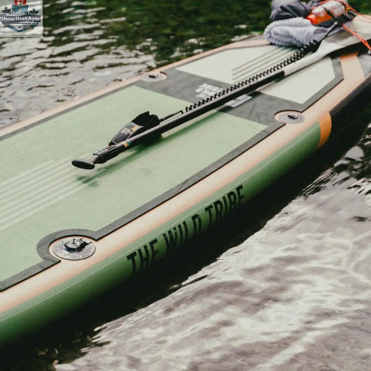 Green Sequoia 11' inflatable paddleboard by The Wild Tribe, designed for stable paddling and versatile canoe adventures.