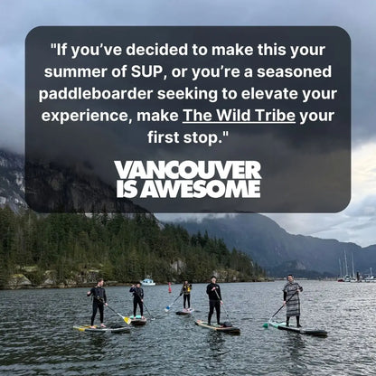 Naïa 11' inflatable paddleboard by The Wild Tribe, shown on water with paddle and gear, ideal for water sports and outdoor adventures.