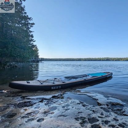 Naïa 11' inflatable paddleboard by The Wild Tribe, versatile touring paddleboard on water with a sleek design.