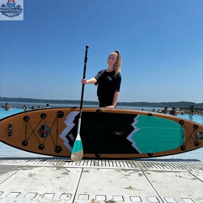 Naïa 11' inflatable paddleboard by The Wild Tribe, versatile touring paddleboard on water with a sleek design and sturdy build.