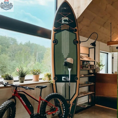 Green Sequoia XL inflatable paddleboard by The Wild Tribe, 11-foot lightweight and durable stand-up paddleboard for water activities.