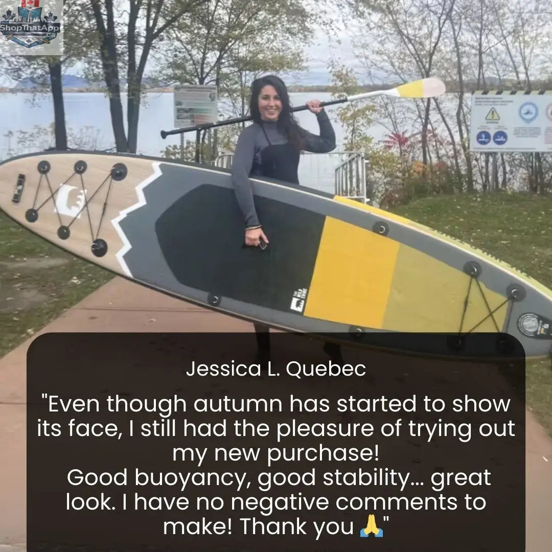Inflatable Peyto 11' paddleboard from The Wild Tribe, shown on water with paddle, ready for kayaking or surfing adventures.