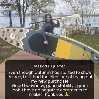 Inflatable Peyto 11' paddleboard from The Wild Tribe, shown on water with paddle, ready for kayaking or surfing adventures.