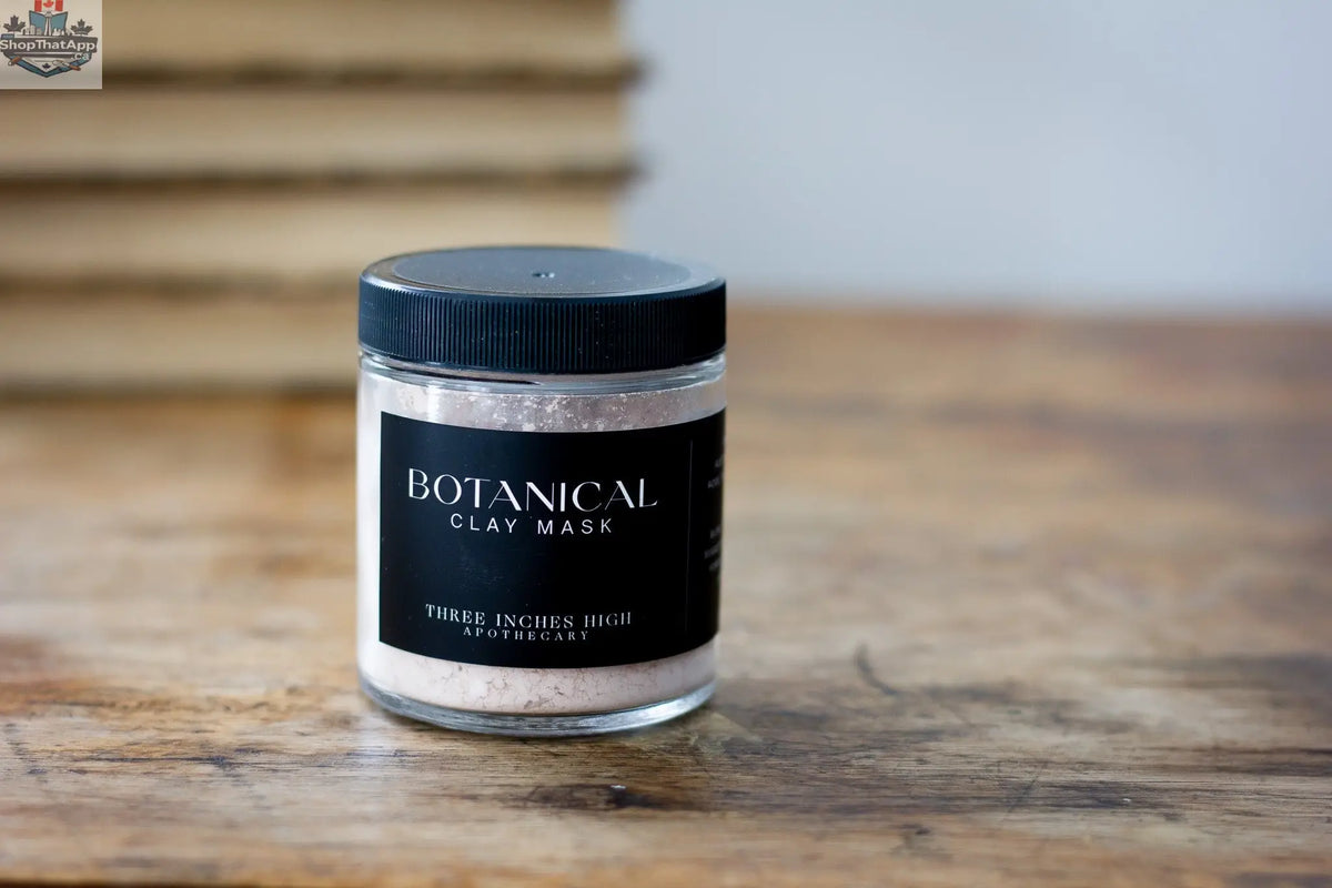 Botanical clay mask by Three Inches High, showing a natural clay mask in a bowl with botanical ingredients for skincare.