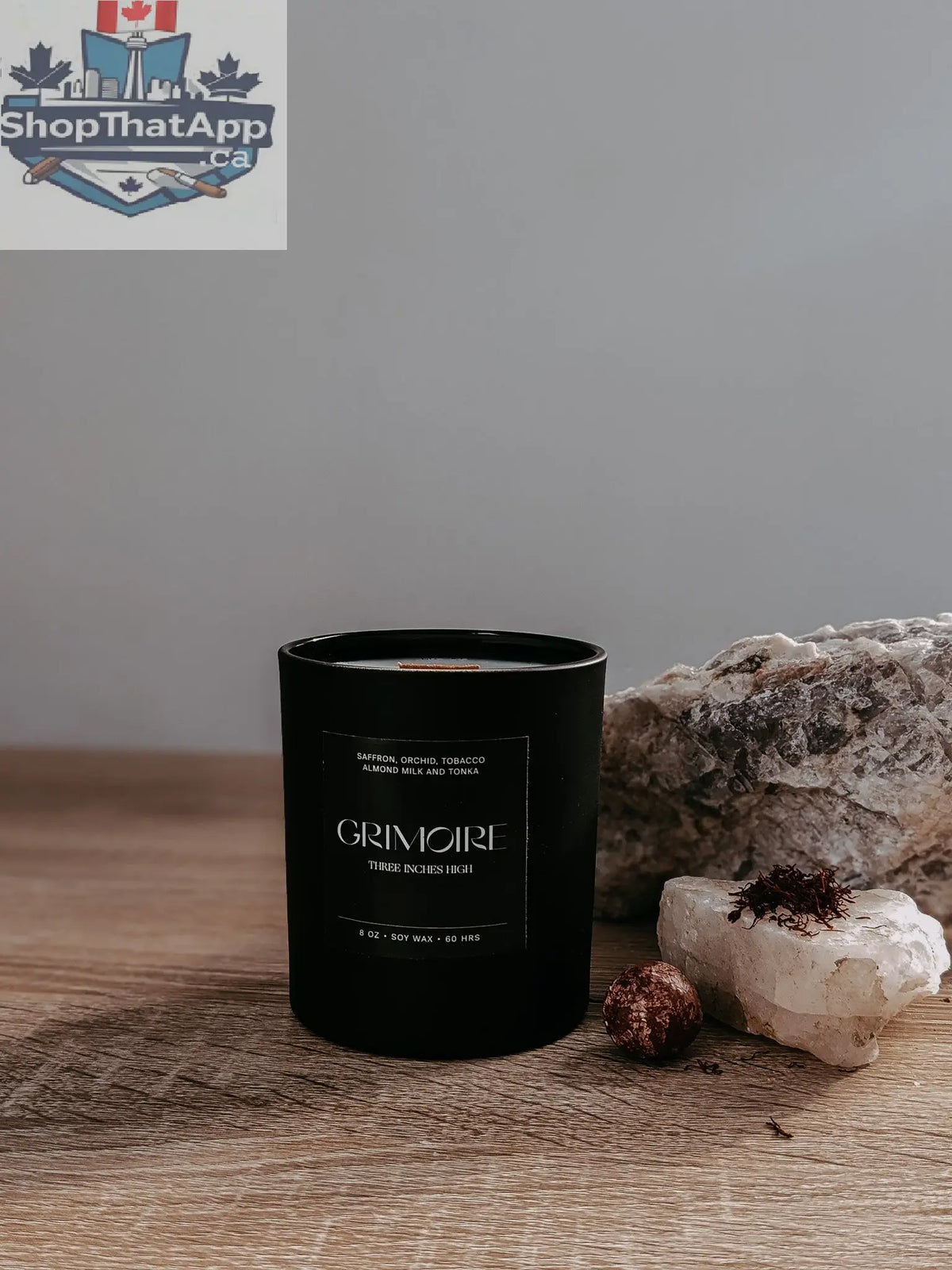 8oz soy wax Grimoire Candle by Three Inches High featuring a mystical book design and warm candle flame.