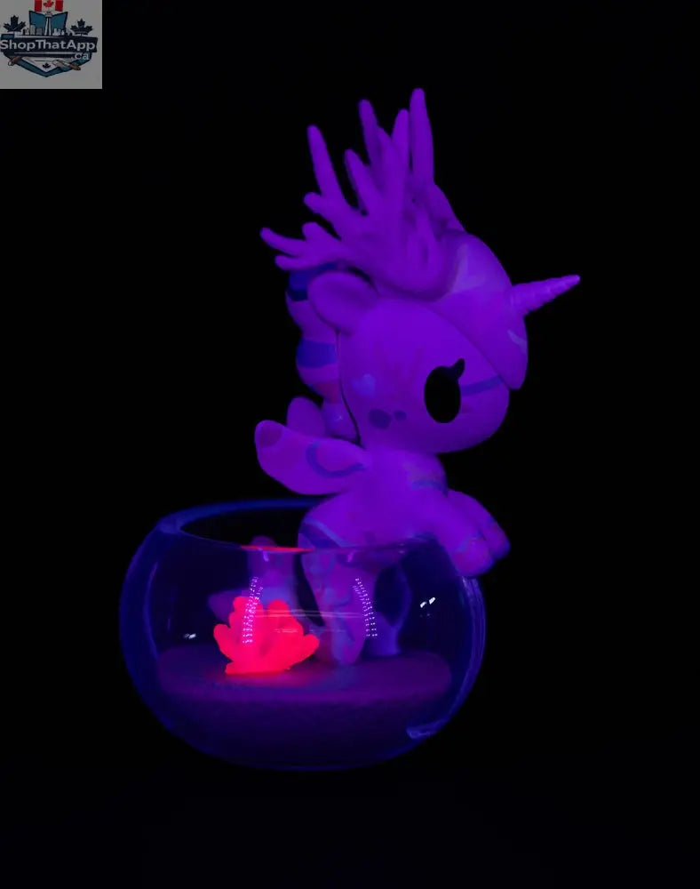 Colorful Neon Reef Mermicorno toy from tokidoki in a blind box, featuring vibrant neon details and a playful mermaid unicorn design.