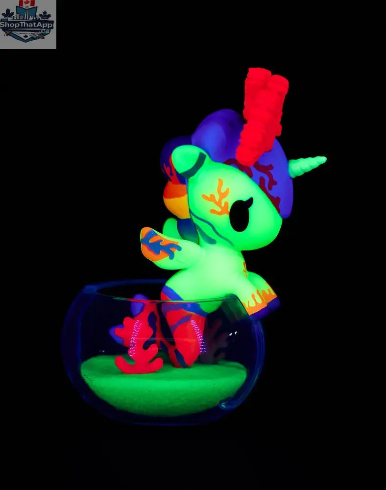 Colorful Neon Reef Mermicorno toy from tokidoki in a blind box, featuring vibrant neon details and cute mermaid unicorn design.