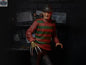 Toy Snowman Freddy Krueger action figure from A Nightmare On Elm Street, featuring detailed costume and iconic glove.